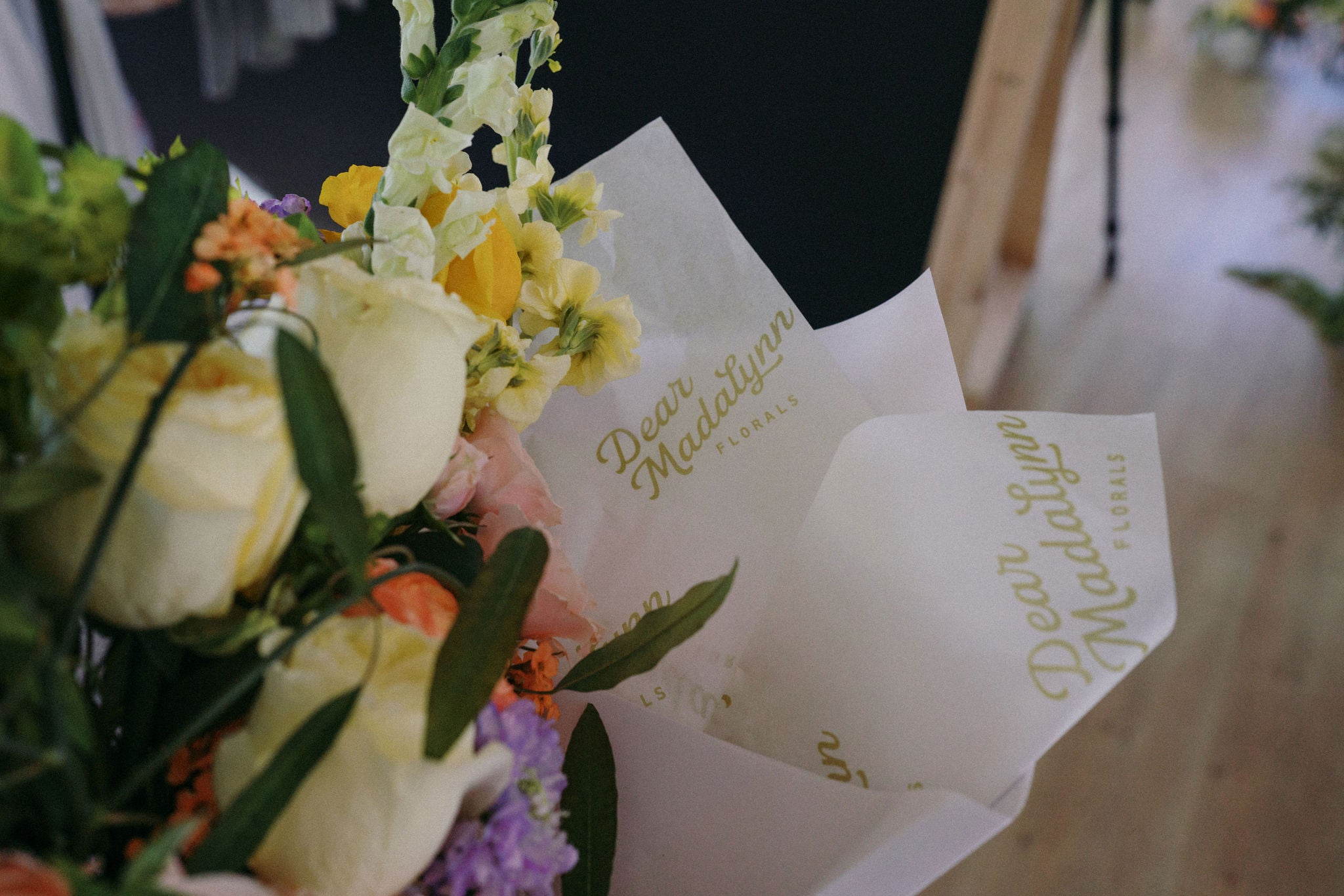 Bouquet of flowers with personalized cards on a blurred background